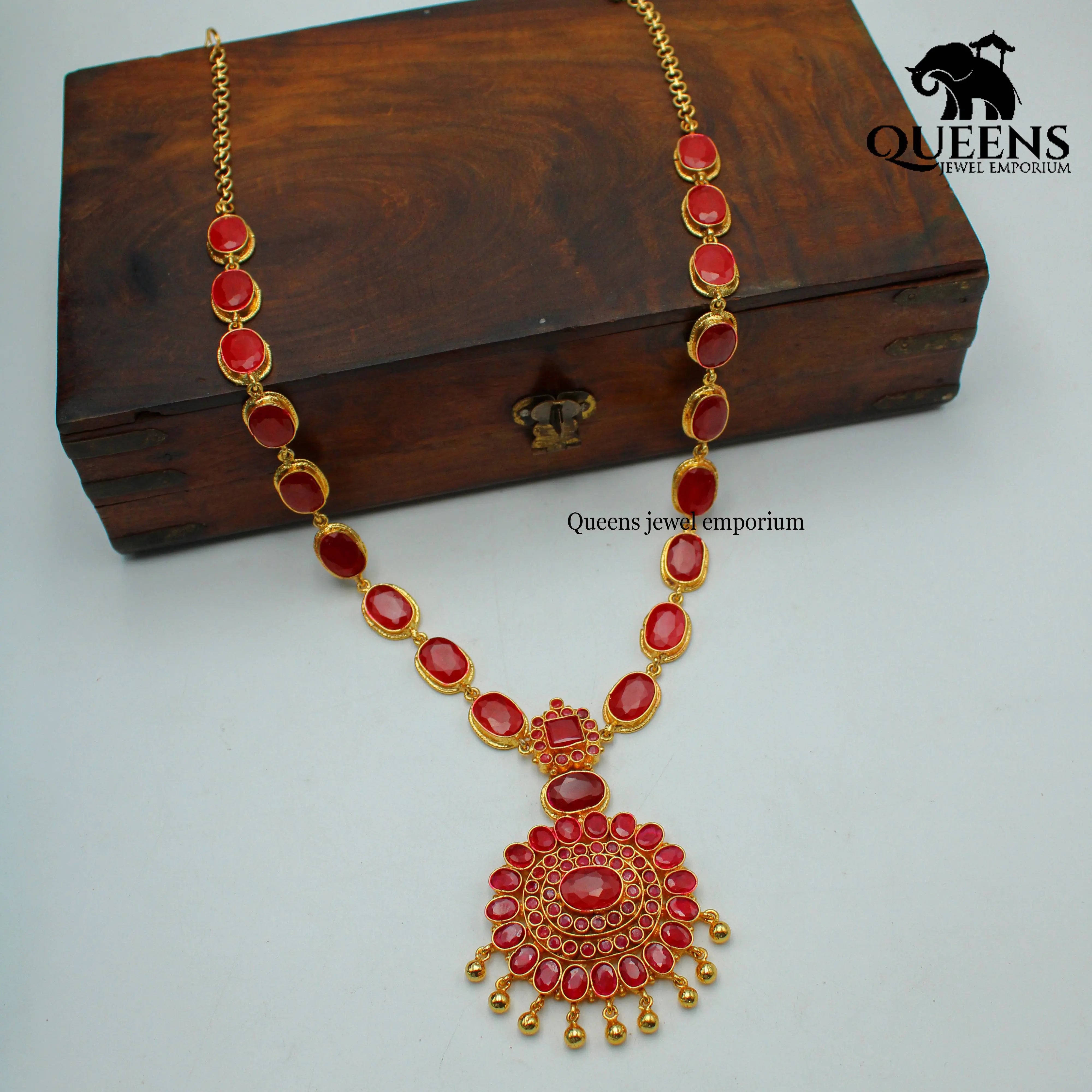 Red kemp stones , Floral motif pendant , Oval shaped stone