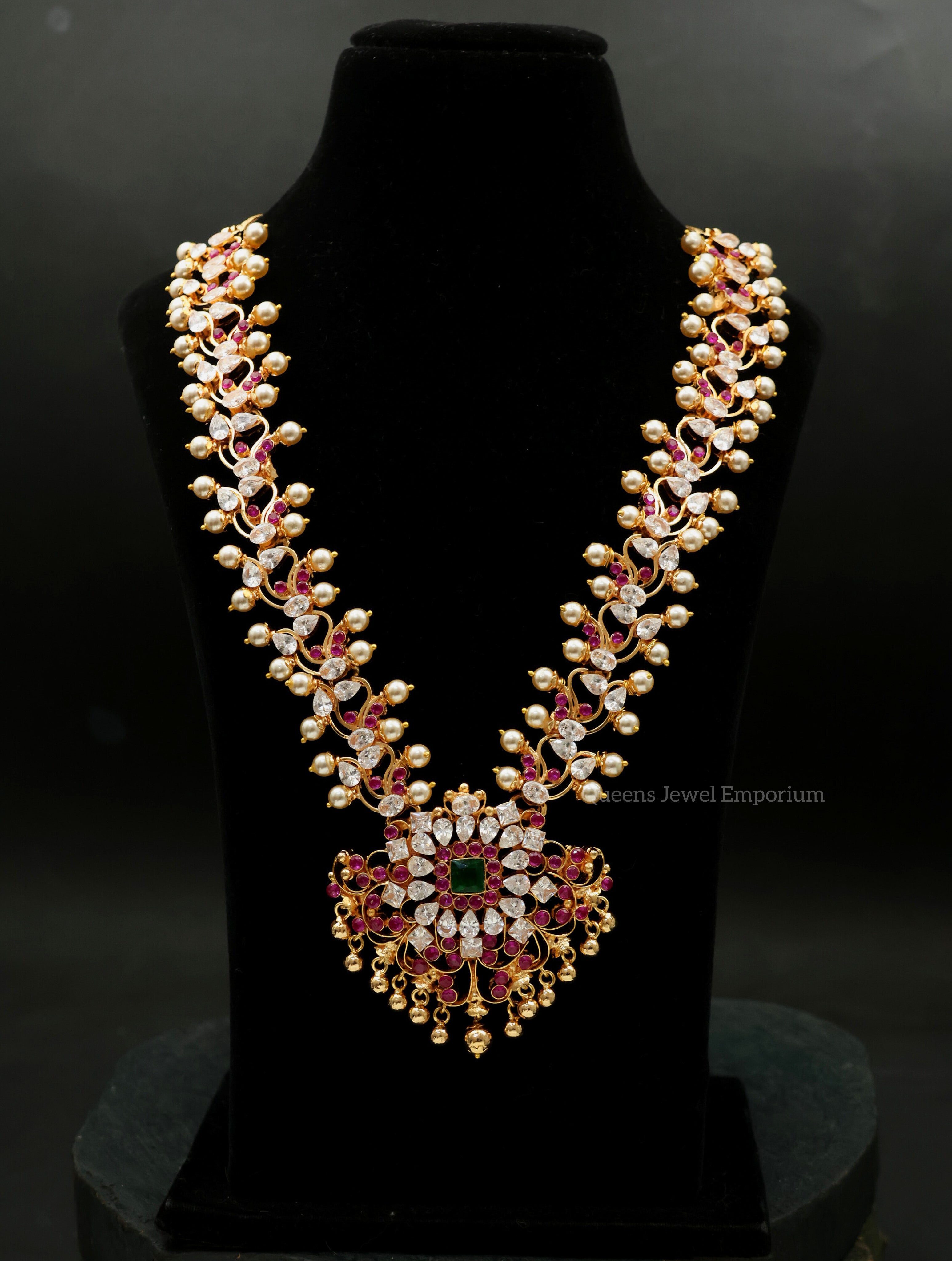 Muthumagal haram with white stones-Pearls and pink-green floral detailing